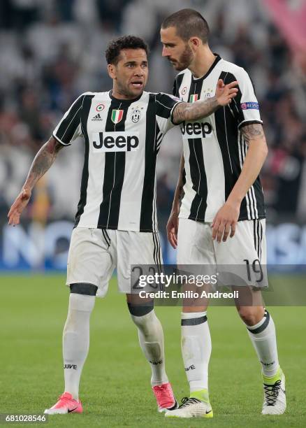 Daniel Alves da Silva of Juventus FC speaks to his team mate Leonardo Bonucci during the UEFA Champions League Semi Final second leg match between...