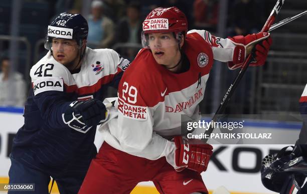 Slovakia´s Tomas Zigo and Denmark's Morten Madsen vie for the puck during the IIHF Ice Hockey World Championships first round match between Slovakia...