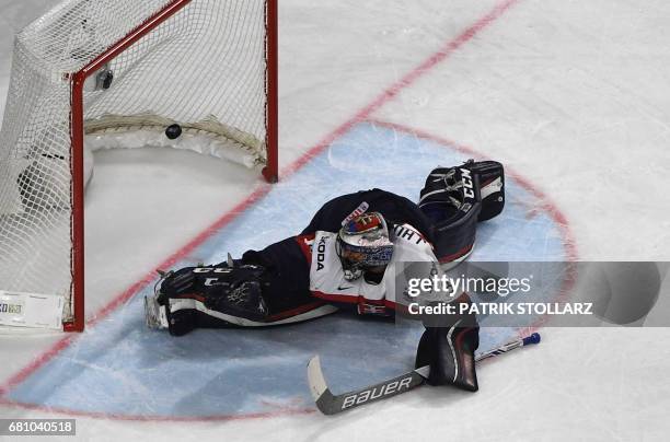 Slovakia´s goalkeeper Julius Hudacek fails to make a save during the IIHF Ice Hockey World Championships first round match between Slovakia and...
