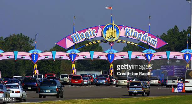 Cars stack up at the toll booth for parking as they arrive at the Magic Kingdom November 11, 2001 in Orlando, Florida.