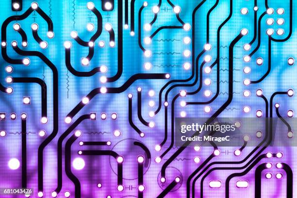 blue and purple colored circuit board - c computer code stock pictures, royalty-free photos & images