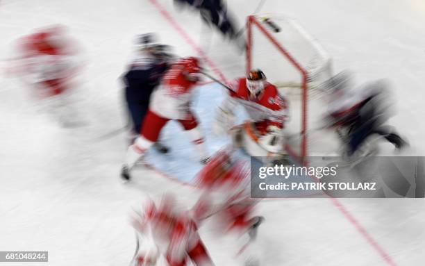 Denmark's and Slovakia's players vie during the IIHF Ice Hockey World Championships first round match between Slovakia and Denmark in Cologne,...