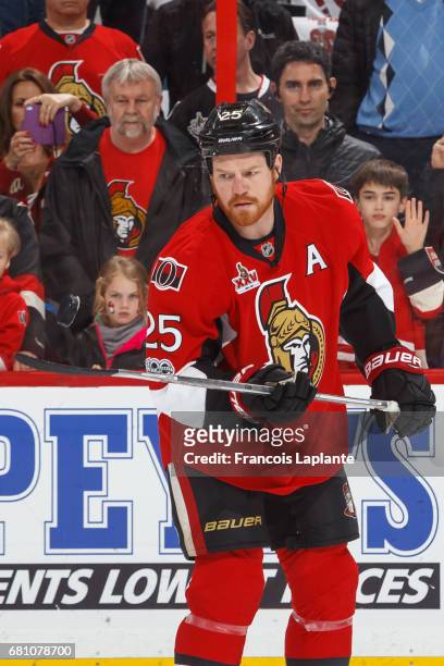 Chris Neil of the Ottawa Senators flips a puck on his stick during warmup prior to Game Five of the Eastern Conference Second Round against the New...