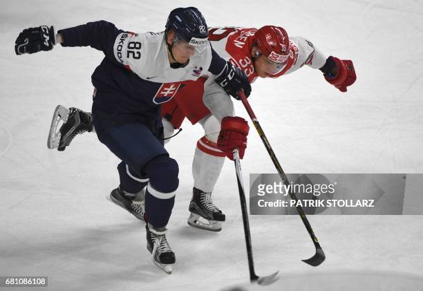 Slovakia´s Pavol Skalicky and Denmark's Julian Jakobsen vie for the puck during the IIHF Ice Hockey World Championships first round match between...