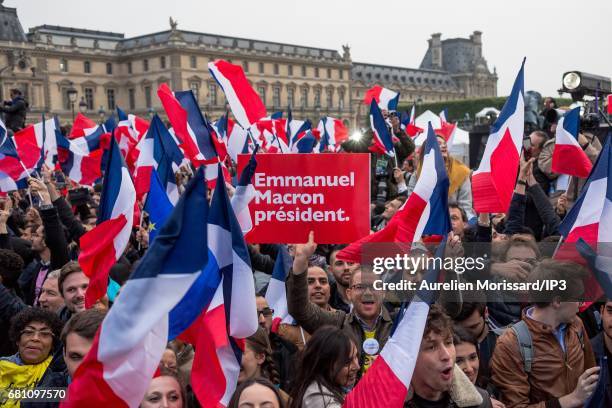 Supporters celebrate victory of Emmanuel Macron , Founder and Leader of the political movement 'En Marche !' and elected as new French President at...