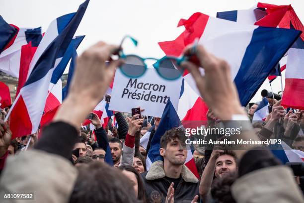 Supporters celebrate victory of Emmanuel Macron , Founder and Leader of the political movement 'En Marche !' and elected as new French President at...