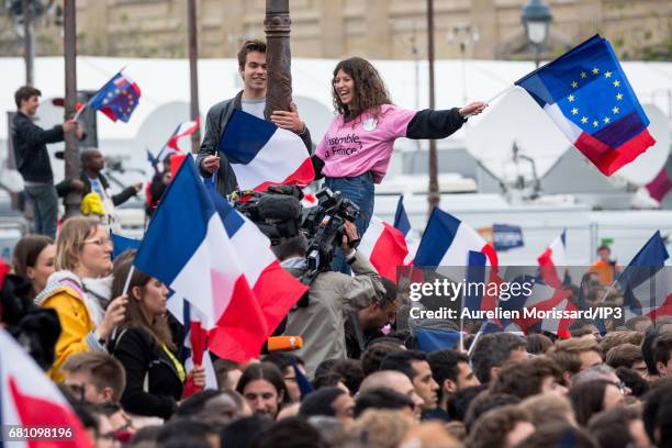 Supporters celebrate victory of Emmanuel Macron , Founder and Leader of the political movement 'En Marche !' and elected as new French President at...