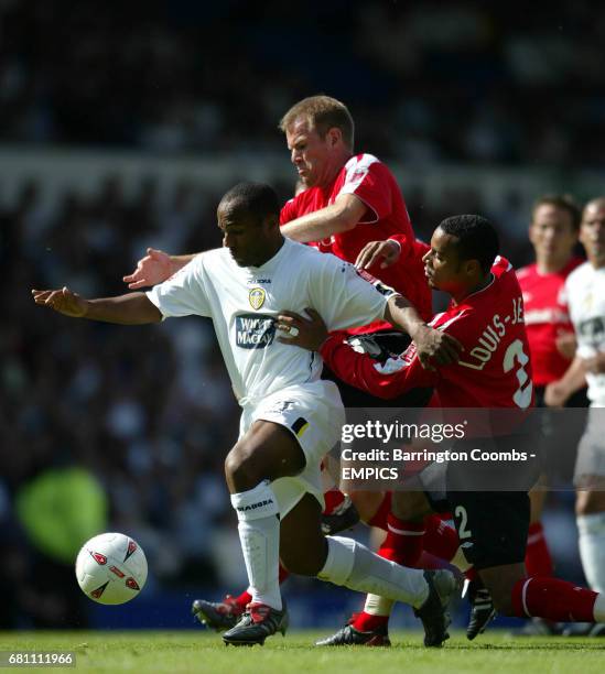 Leeds United's Julian Joachim and Nottingham Forest's Jon Olav Hjelde and Matthieu Louis-Jean battle for the ball