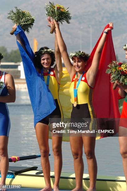 Romania's Georgeta Damian and Viorica Susanu celebrate after recieving thier gold medals