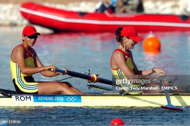 Romania's Georgeta Damian and Viorica celebrate winning gold