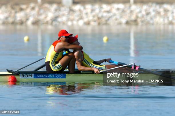 Romania's Georgeta Damian and Viorica celebrate winning gold