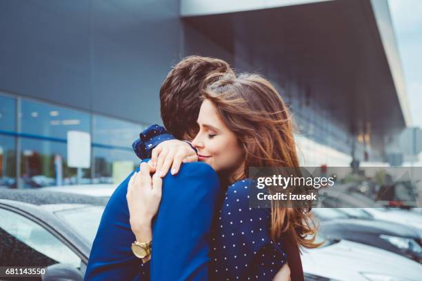 loving couple say good bye at airport - embracing car stock pictures, royalty-free photos & images