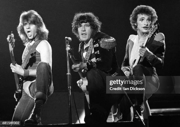 Chris Glen, Alex Harvey and Zal Cleminson of The Sensational Alex Harvey Band performing on stage at Rainbow Theatre, London, 24 January 1977.
