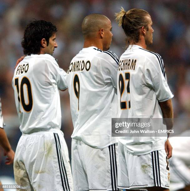 L-r; Real Madrid's Luis Figo, Ronaldo and David Beckham line up a defensive wall for a free kick