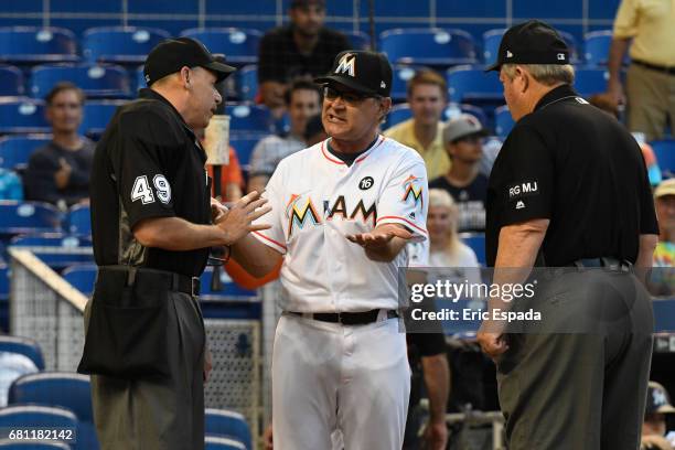Manager Don Mattingly of the Miami Marlins argues with Home Plate Umpire Andy Fletcher after being ejected from the game during the first inning...