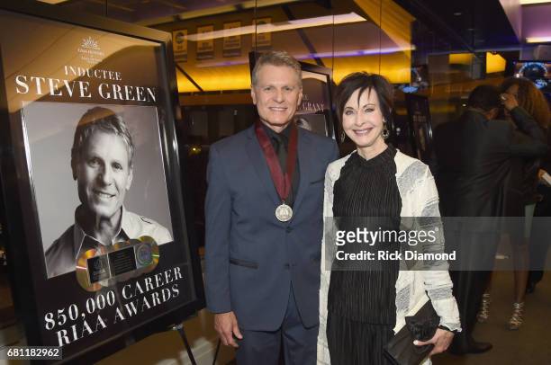 Inductee Steve Green and Marijean McCarly take photos with his award at the GMA Honors on May 9, 2017 in Nashville, Tennessee.