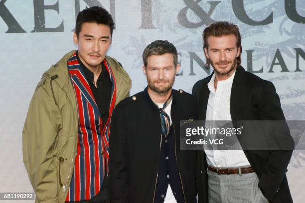 Chinese model and actor Hu Bing , Kent & Curwen Creative Director Daniel Kearns and English former professional footballer David Beckham attend Kent...