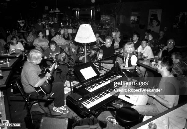 Nashville musicians and songwriters perform 'in the round' at a live music venue in Nashville, Tennessee, in 2001. Among the performers are Al...