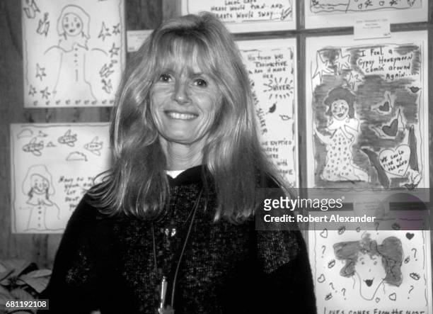 Singer Kim Carnes poses with some of her drawings for sale at a 2001 fundraising event in Leiper's Fork, a community near Nashville, Tennessee.