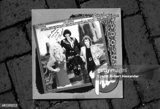 Record album featuring singers Dolly Parton, Linda Ronstadt and Emmylou Harris is inscribed and autographed by the three singers. The album, titled...