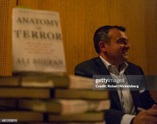 Ali Soufan, a former FBI-agent who was involved in multiple high profile anti-terrorism cases, signs copies of his new book, "Anatomy of Terror," May...