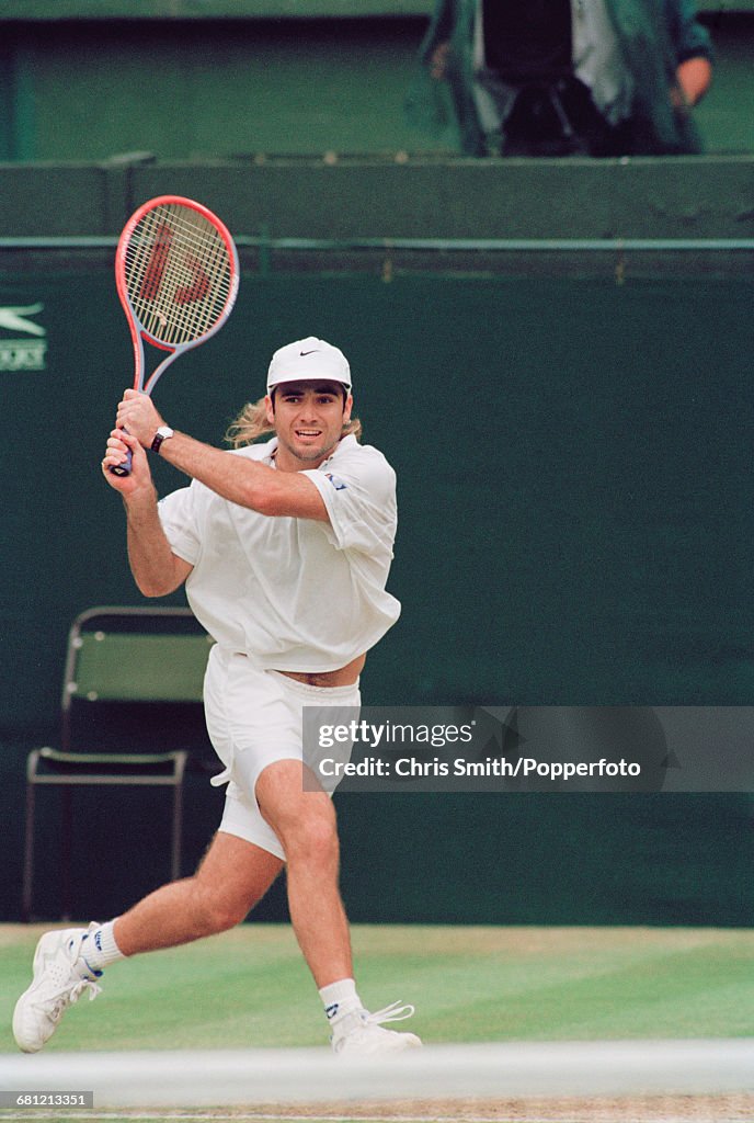American Tennis Player Andre Agassi Pictured In Action To Win His american-tennis-player-andre-agassi-pictured-in-action-to-win-his