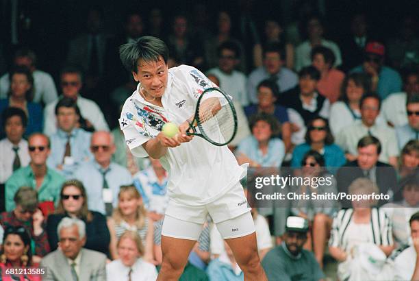 American tennis player Michael Chang pictured in action to reach the third round of the Men's Singles tournament at the Wimbledon Lawn Tennis...