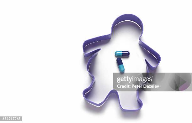 overweight cookie cutter with diet pills - obesity concept stock pictures, royalty-free photos & images