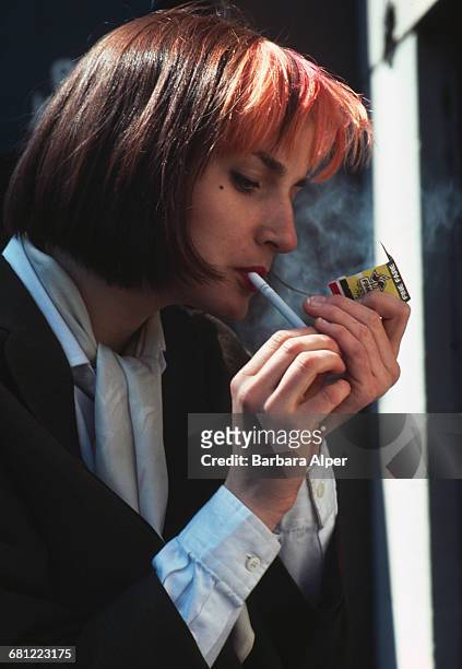 Woman smoking in New York City, April 1980.
