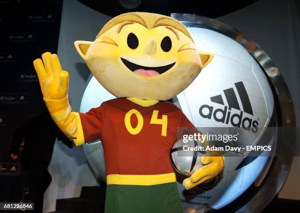 The Euro 2004 mascot Kinas with the new Adidas Match ball