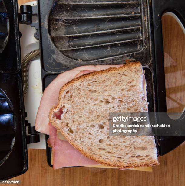 preparing croque monsieur. - croque monsieur stockfoto's en -beelden
