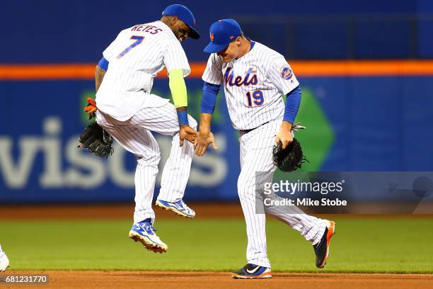 Jay Bruce and Jose Reyes of the New York Mets celebrate after defeating the San Francisco Giants 6-1 at Citi Field on May 9, 2017 in the Flushing...
