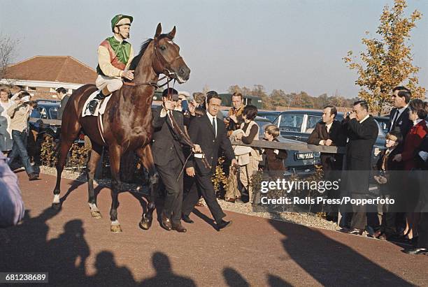 English professional jockey Lester Piggott pictured mounted on the racehorse Nijinsky before competing to win in the 2000 Guineas Stakes on the...