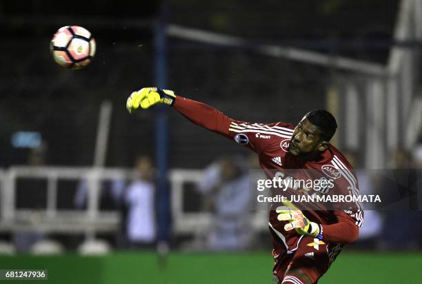 Brazil's Ponte Preta goalkeeper Aranha passes the ball during their Copa Sudamericana first stage second leg football match against Argentina's...