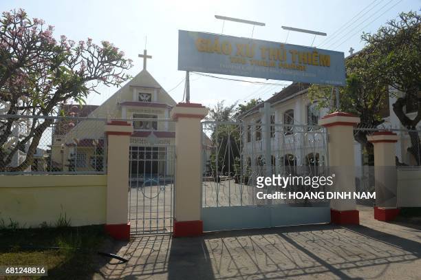 This picture taken on February 21, 2017 shows the old church of Thu Thiem parish established since 1859 and located on the bank of Saigon river in Ho...