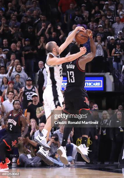 Manu Ginobili of the San Antonio Spurs makes the block against the three-point attempt by James Harden of the Houston Rockets in the final second of...