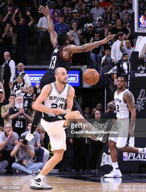 Manu Ginobili of the San Antonio Spurs makes the block against the three-point attempt by James Harden of the Houston Rockets in the final second of...