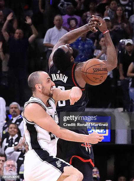 Manu Ginobili of the San Antonio Spurs makes the block against the three-point attempt by James Harden of the Houston Rockets in the final second of...