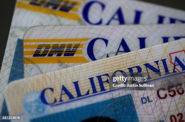 In this photo illustration, the California Department of Motor Vehicles logo appears on a California driver license on May 9, 2017 in San Anselmo,...