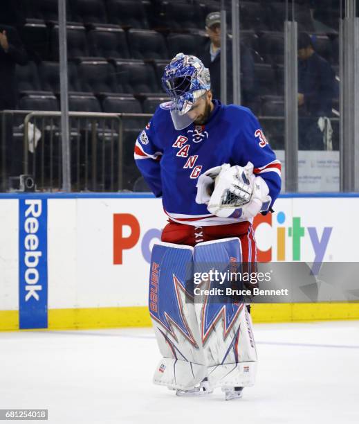 Henrik Lundqvist of the New York Rangers reacts after losing to the Ottawa Senators with a score of 4 to 2 in Game Six of the Eastern Conference...