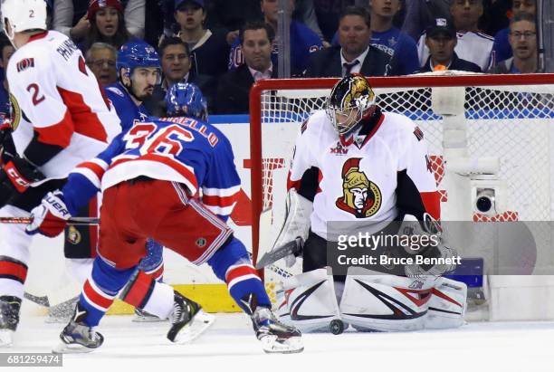 Craig Anderson of the Ottawa Senators makes the save on Mats Zuccarello of the New York Rangers in Game Six of the Eastern Conference Second Round...