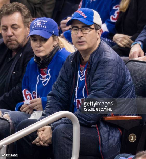 John Oliver and Kate Norley attend Ottawa Senators Vs. New York Rangers 2017 Playoff Game on May 9 at Madison Square Garden in New York City.