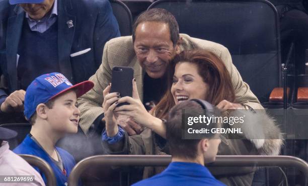 Debra Messing and son, Roman Zelman take a selfie with Paul Anka during the Ottawa Senators Vs. New York Rangers 2017 Playoff Game on May 9, 2017 at...