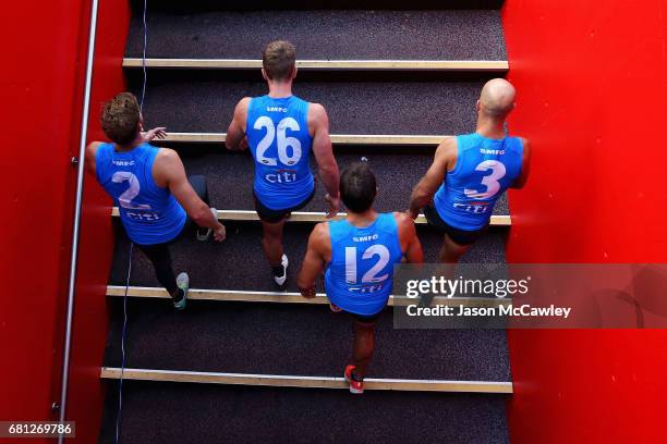 Alex Johnson, Luke Parker, Josh P Kennedy and Jarrad McVeigh of the Swans take to the field during a Sydney Swans AFL training session at Sydney...