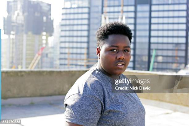 young street dancer on london rooftop overlooking the city - serious teenager boy stock-fotos und bilder