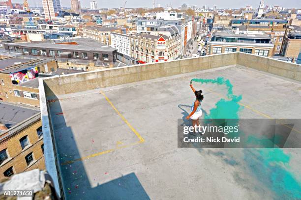 teenager on london rooftop overlooking the city - distress flare stock pictures, royalty-free photos & images