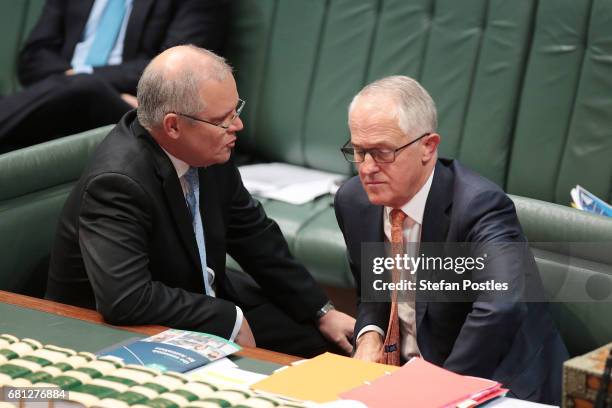 Treasurer Scott Morrison speaks to Prime Minister Malcolm Turnbull during question time at Parliament House on May 10, 2017 in Canberra, Australia....