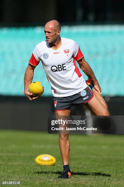Tony Lockett of the Swans stretches during a Sydney Swans AFL training session at Sydney Cricket Ground on May 10, 2017 in Sydney, Australia.