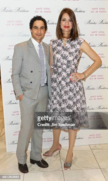 Designer Zac Posen poses with writer Plum Sykes during her book launch celebration for "Party Girls Die In Pearls" at Brooks Brothers on May 9, 2017...