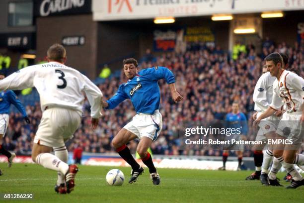 Rangers' Shota Arveladze runs at Motherwell's Steven Hammell